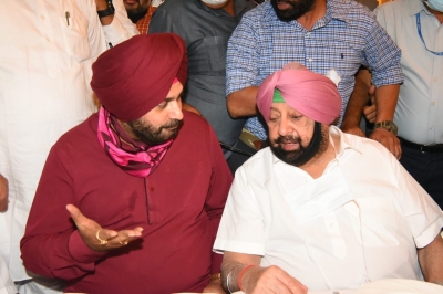 Sidhu takes charge of PCCP president post in CM Singh presence 