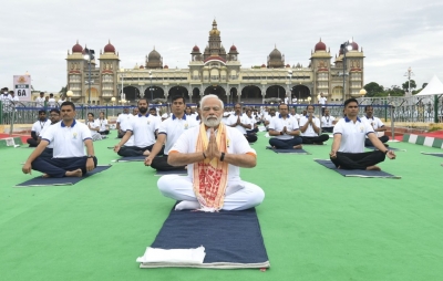 We should learn Yoga and also live - PM Modi