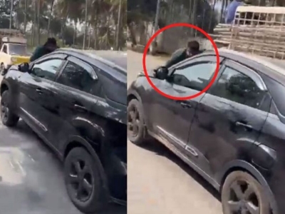 The woman dragged the car without stopping even though the person was stuck on the car bonnet