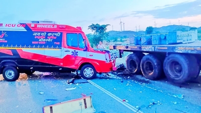 An ambulance carrying a dead body collided with a parked lorry, killing three and injuring two